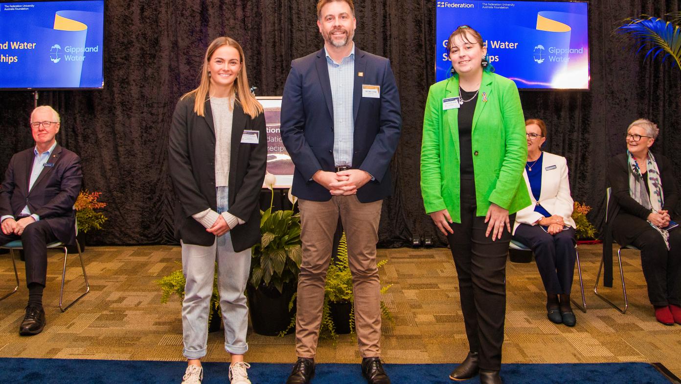 Ella and Chloe with General Manager Michael Crane receiving their awards.