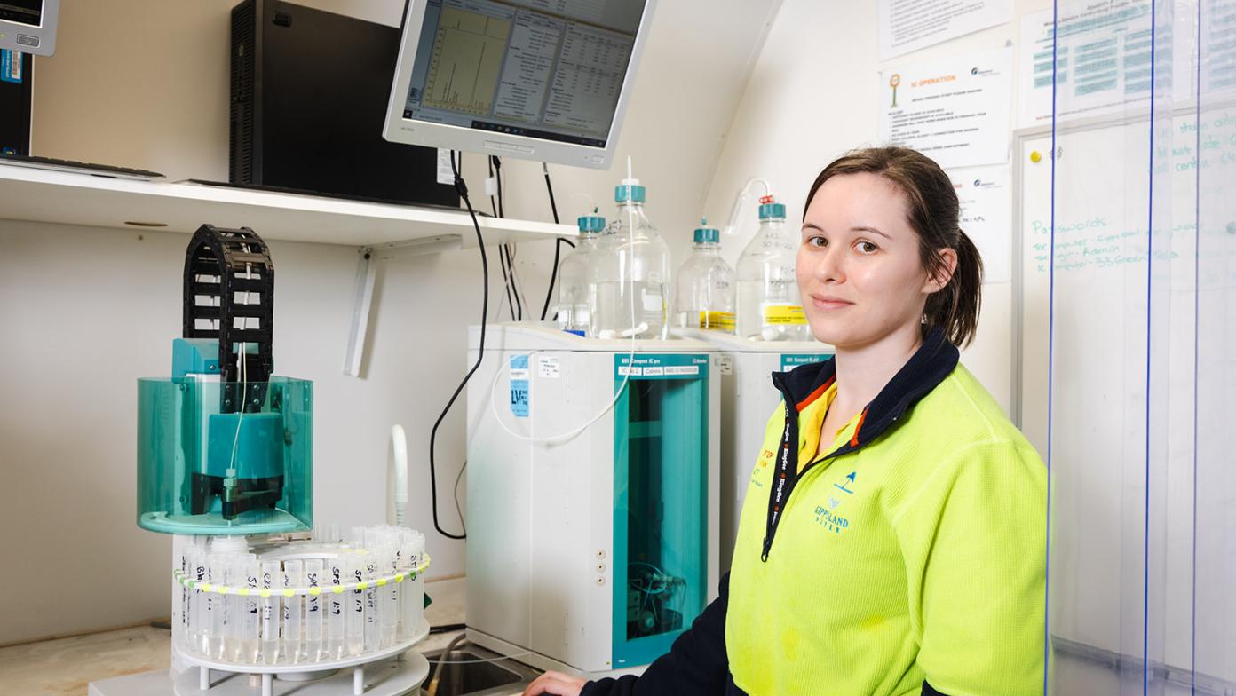 Rowena is in the laboratory and looking at the camera.