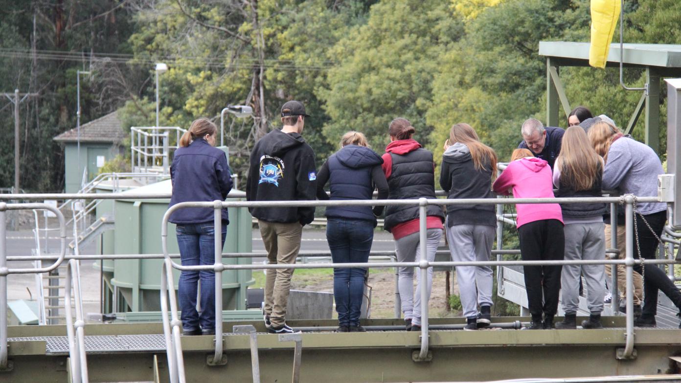 Students looking down from a platform as they tour the Mirboo North Water Treatment Plant