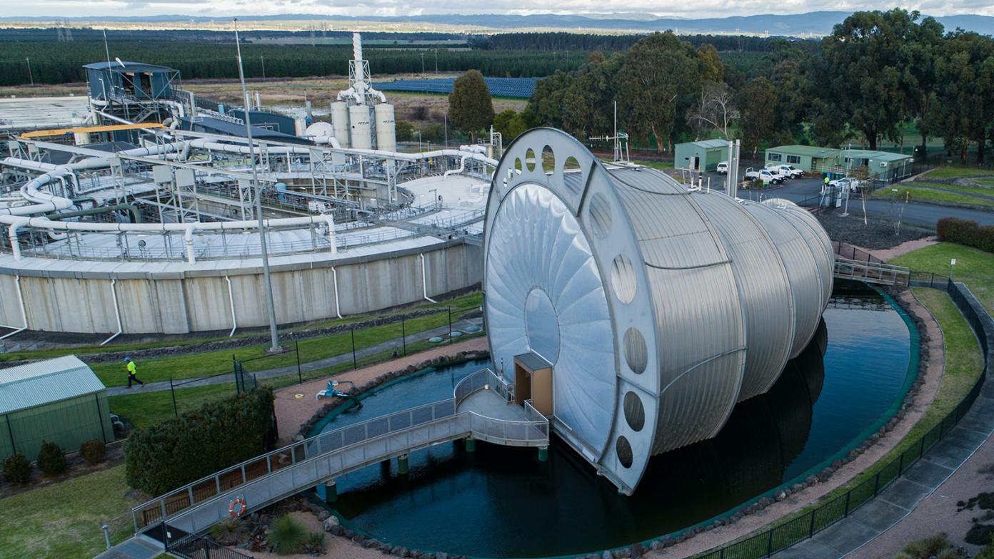 Drone image of large machinery in water.