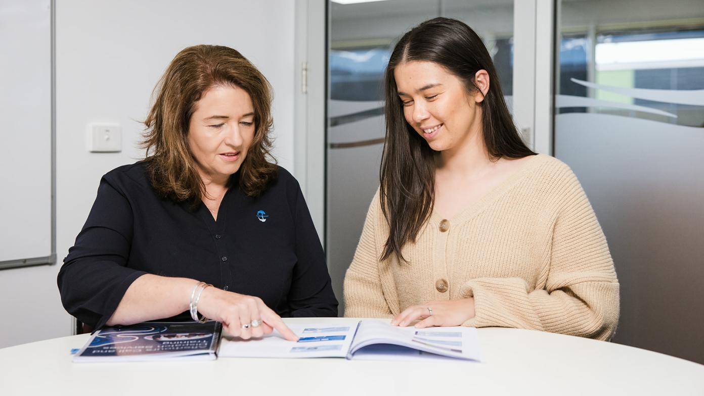 A customer and a Gippsland Water employee discussing a water supply agreement.
