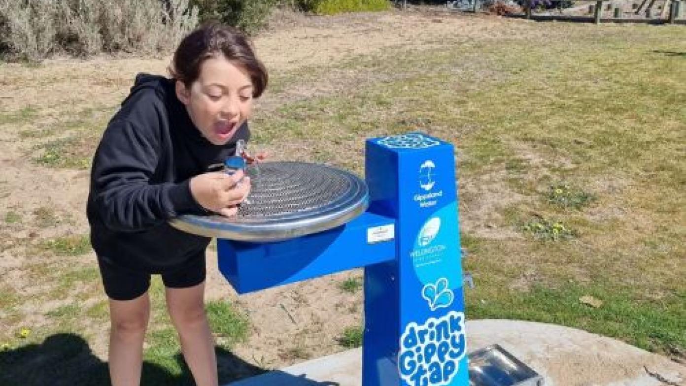 Millie having a drink at the Seaspray pump track 