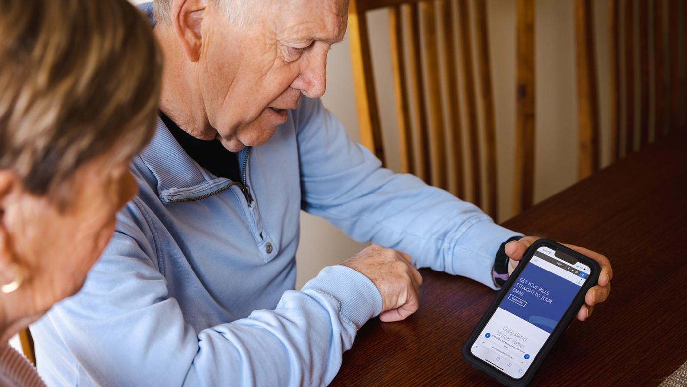 Two customers viewing website on phone