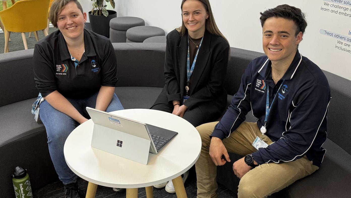Three Gippsland Water employees sitting at a table