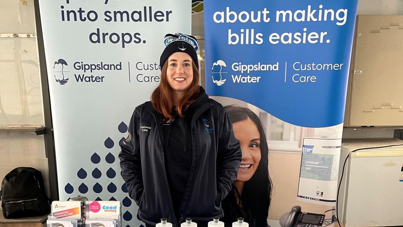 Gippsland Water customer care representative standing at a table
