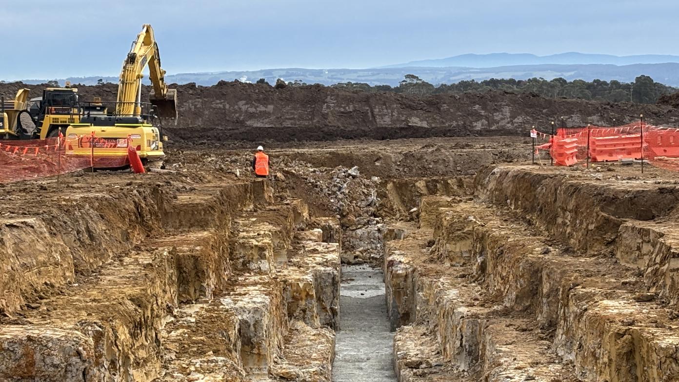 Construction site showing vehicles and construction workers