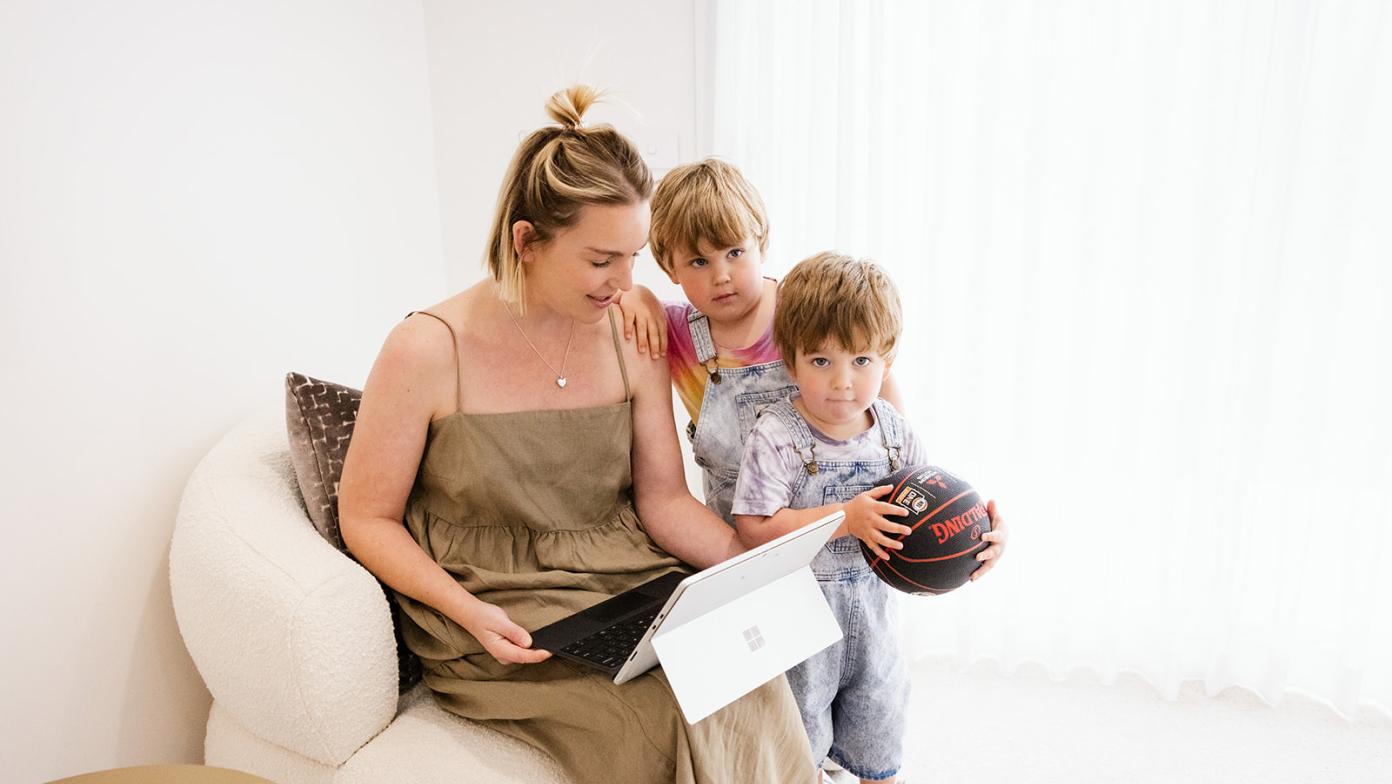 Family looking at laptop