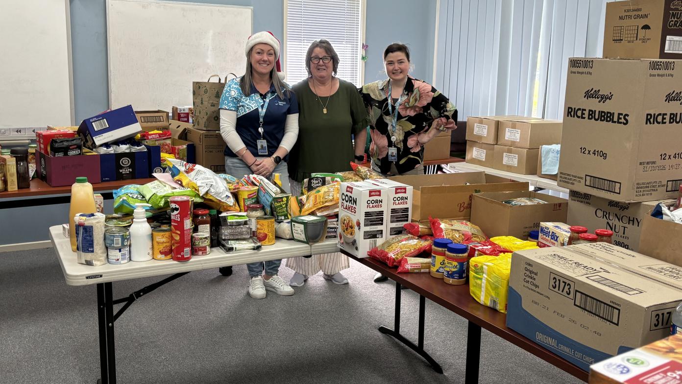Natalie Cowton, Kerry Wilkinson and Sarah Barham surrounded by donations to the Morwell Neighbourhood House Foodbank