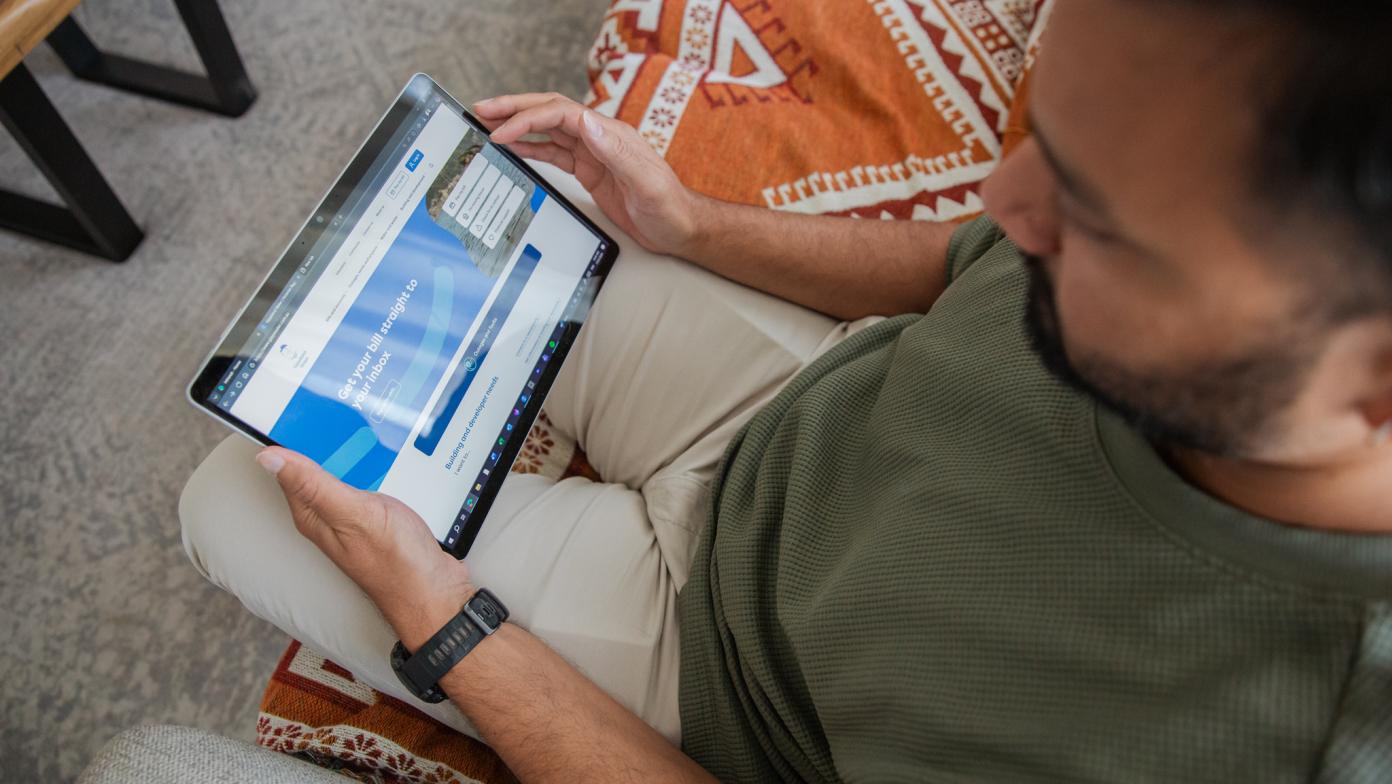 Man looking at Gippsland Water website from a device