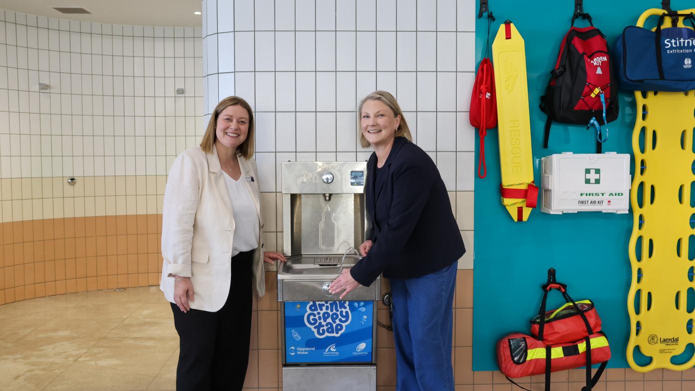 Wellington Shire Council Mayor and Gippsland Water Managing Director using the new drinking water fountain at Aqua Energy in Sale.
