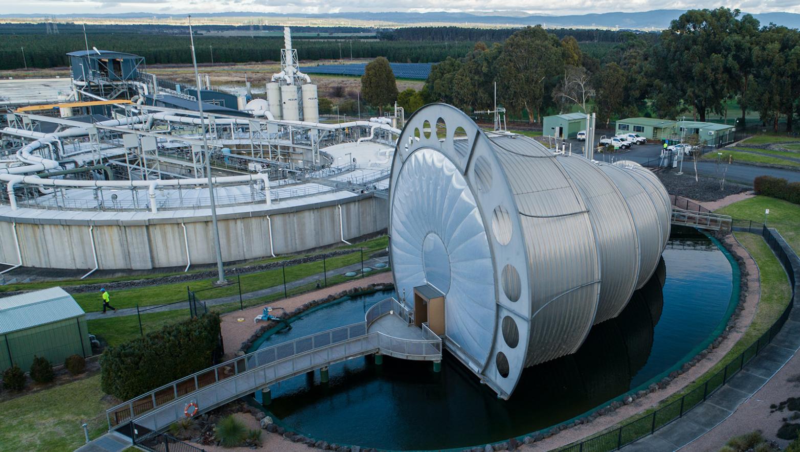 Drone image of large machinery in water.