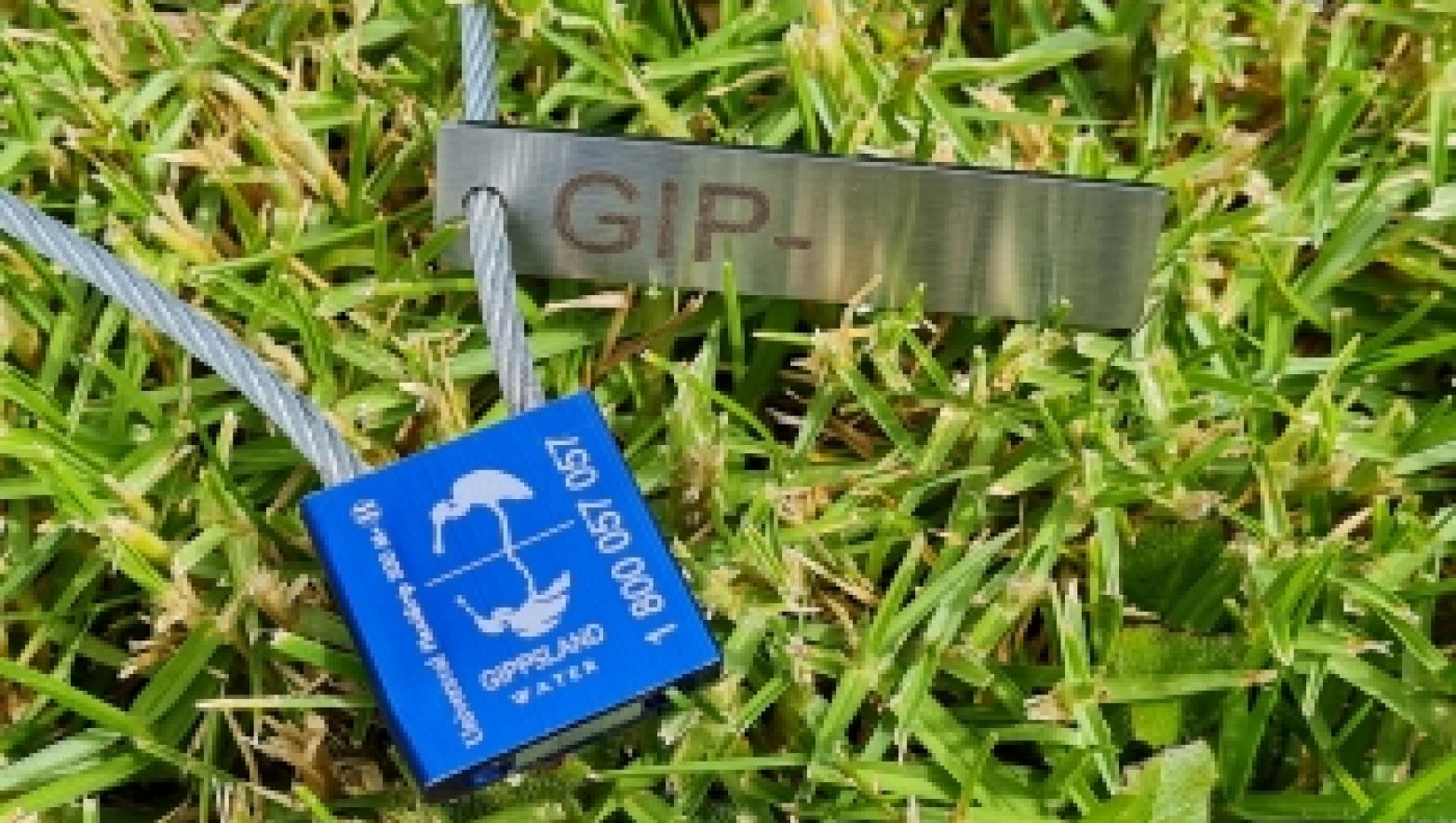 Gippsland Water sample tag on grass