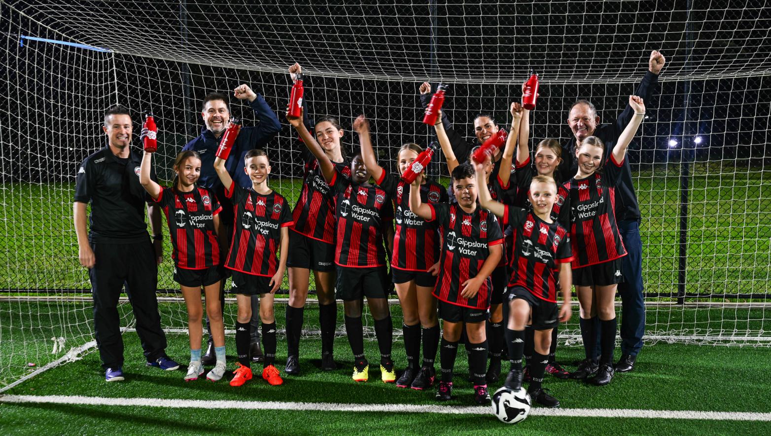 Group of people on soccer pitch
