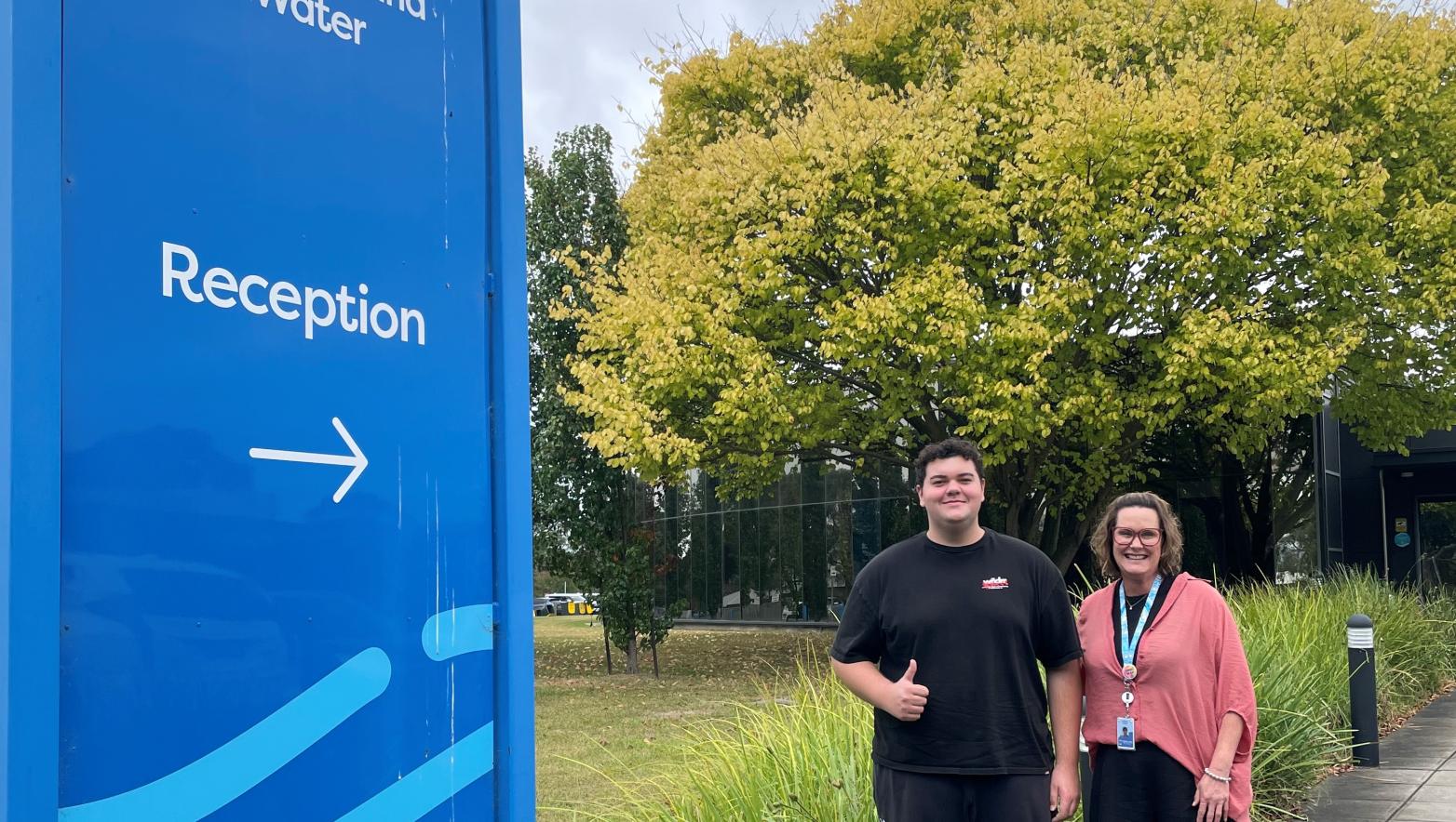 Two Gippsland Water employees standing in front of the Traralgon head office.