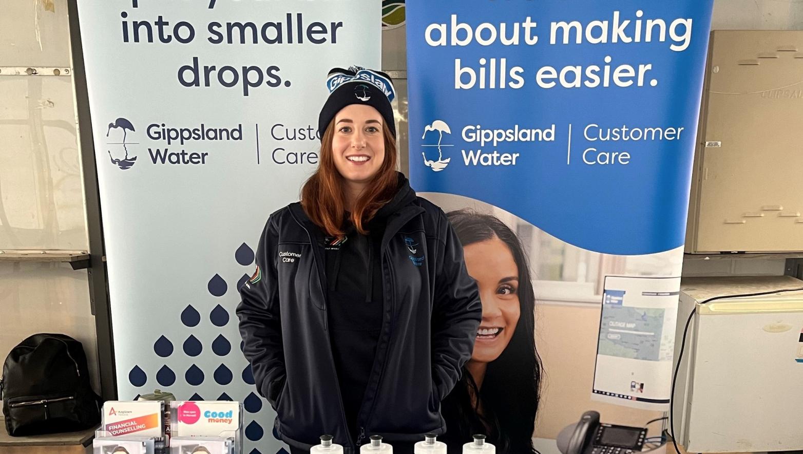 Gippsland Water customer care representative standing at a table