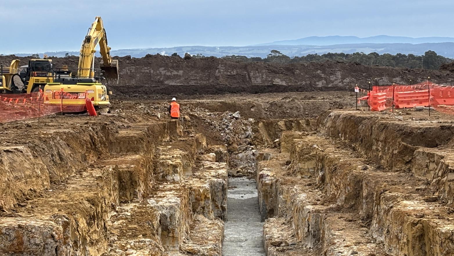 Construction site showing vehicles and construction workers