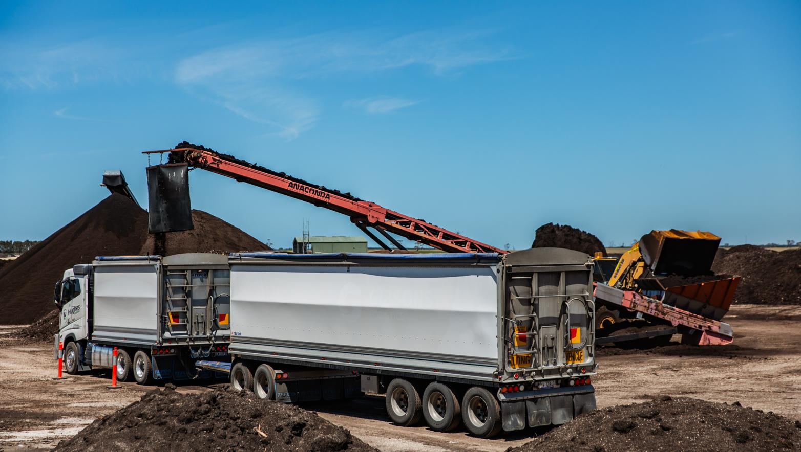 Truck being filled with compost