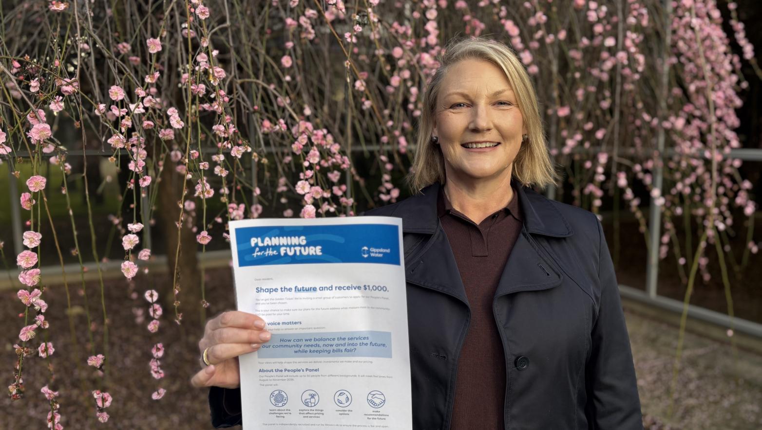 Gippsland Water Managing Director Sarah Cumming holding a letter