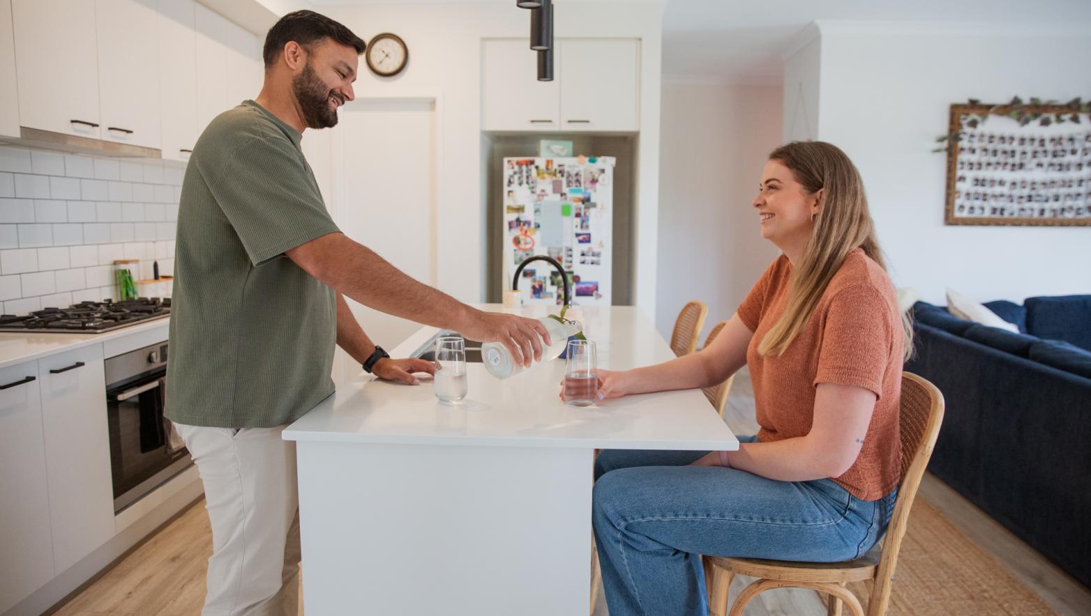 Two people at a kitchen bench