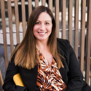 Melissa Thek, General Manager Business Transformation, staring at the camera smiling